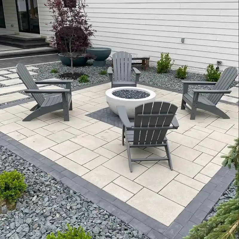 An outdoor stone patio area with seating
