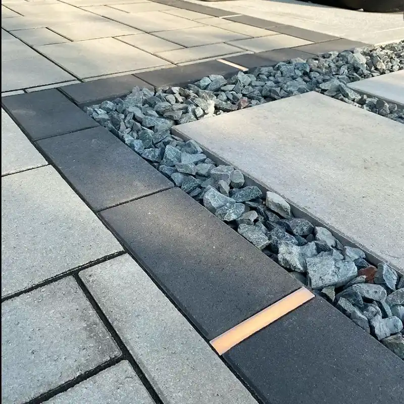 A close-up of a decorative stone paver design on an outdoor patio
