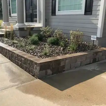 A raised garden bed made of stone