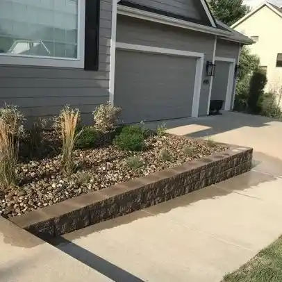 A raised garden bed made of stone