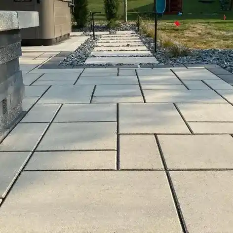A walkway made up of stone pavers