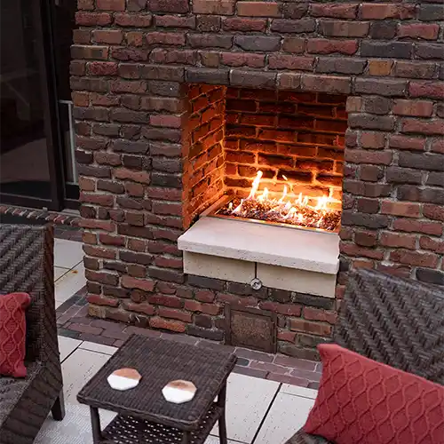A building with an outdoor brick-built fireplace