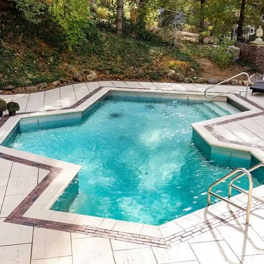 An outdoor pool built in an irregular, 13-sided shape