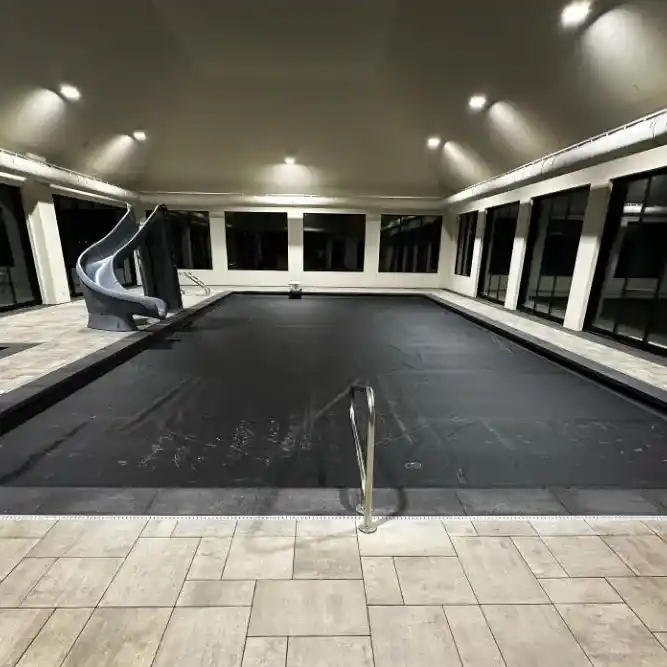 An indoor pool with a slide
